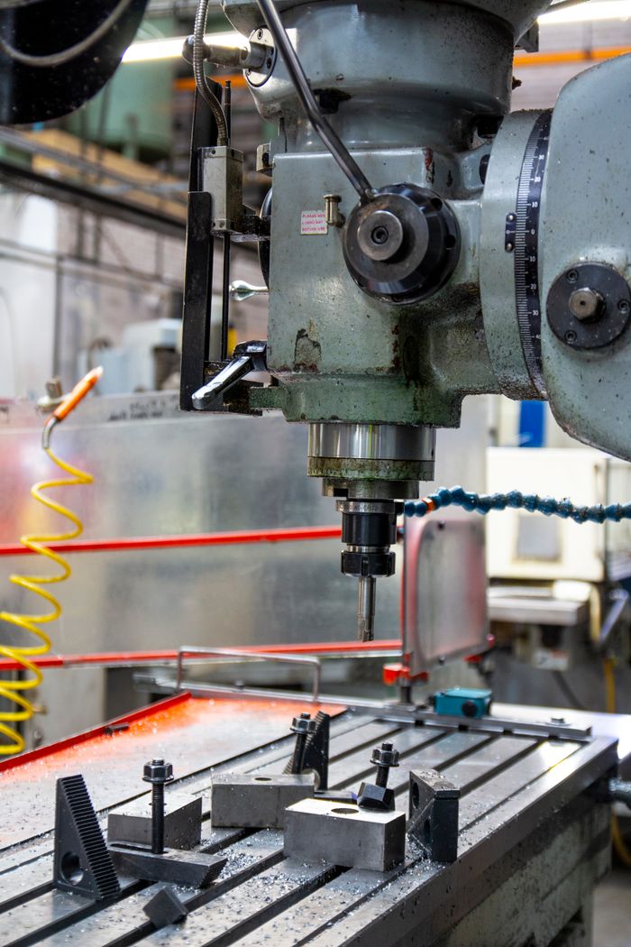 The Art of Drawing Readers In: Your attractive post title goes here Close-up of a lathe machine in a workshop setting, showcasing precision engineering.